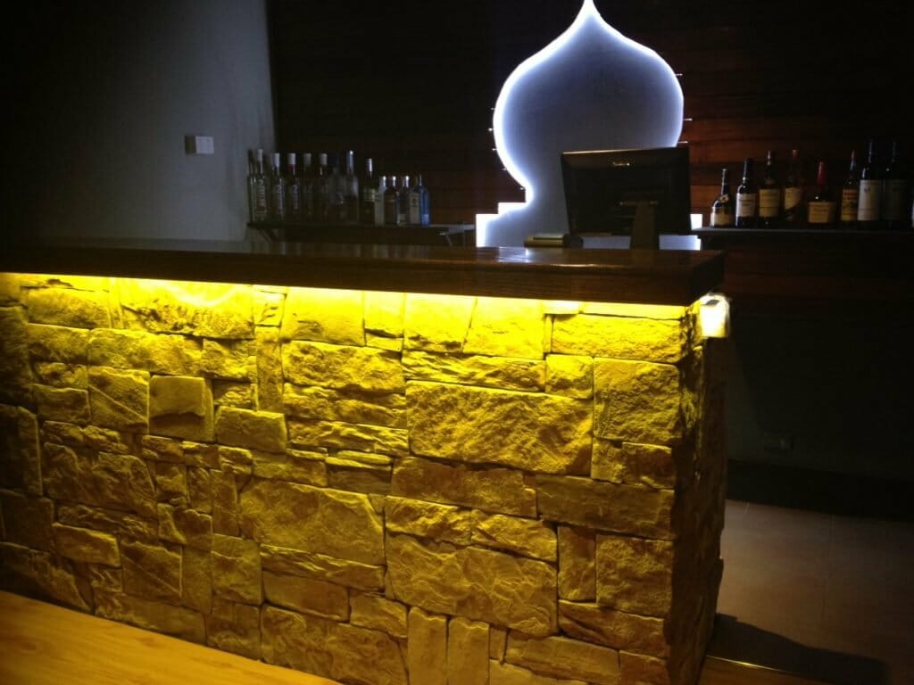 Dry stack sandstone bar feature wall